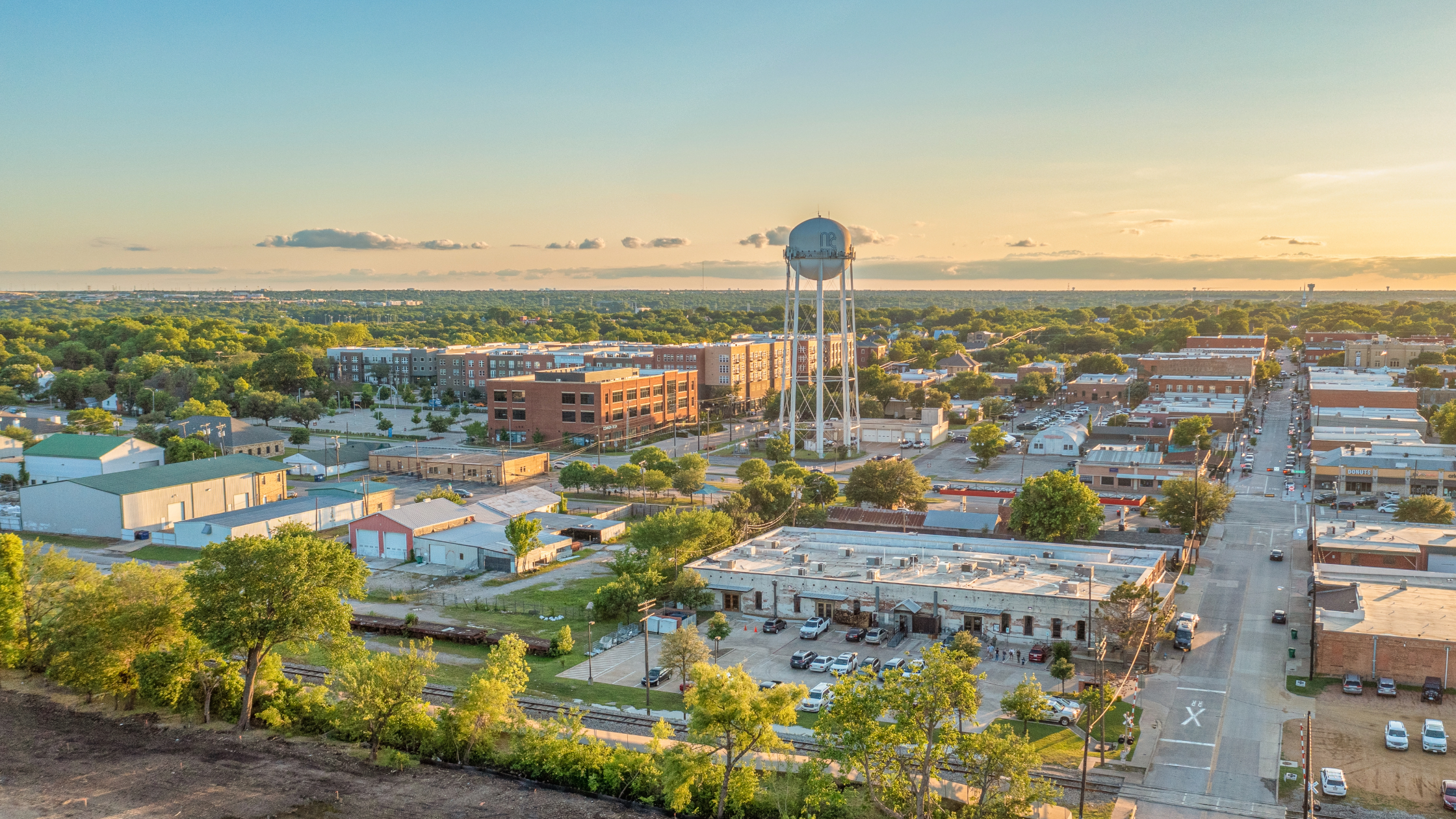 Panoramic aerial view of Frisco, Texas, showcasing the city's modern skyline, vibrant neighborhoods, and iconic landmarks, encapsulating the dynamic growth and appeal of this thriving Texan community